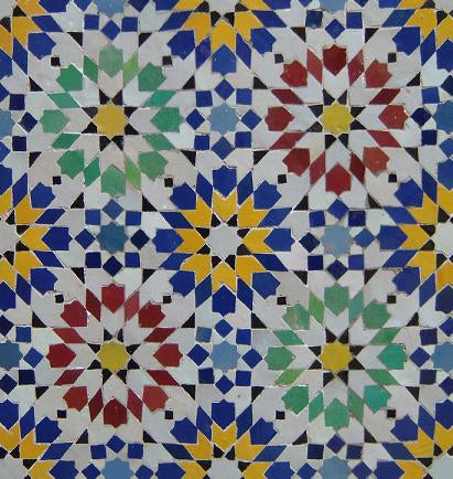Colorful Moroccan Alhambra mosaic tile by Justmorocco featuring intricate geometric patterns and vibrant ceramic design.