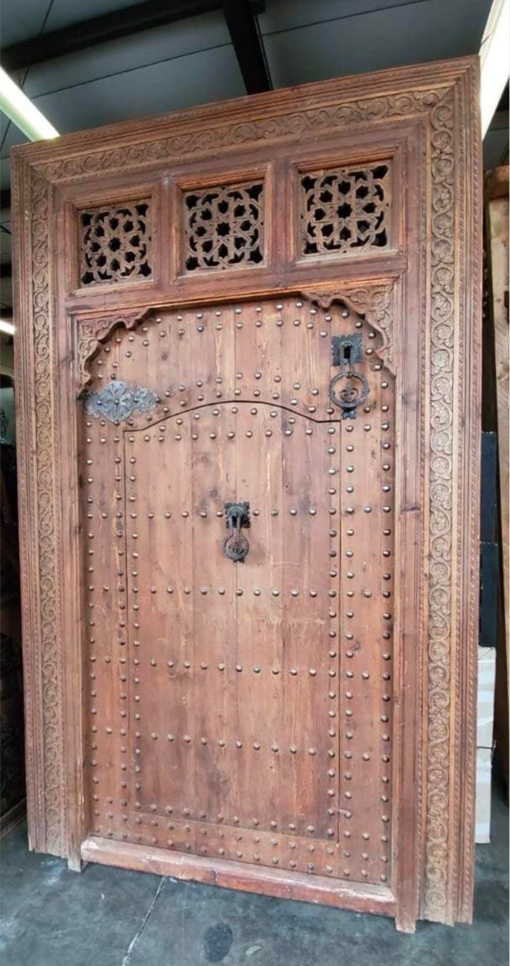 Moroccan cedar door with intricate carvings and traditional design, crafted by Justmorocco for authentic interior decor.