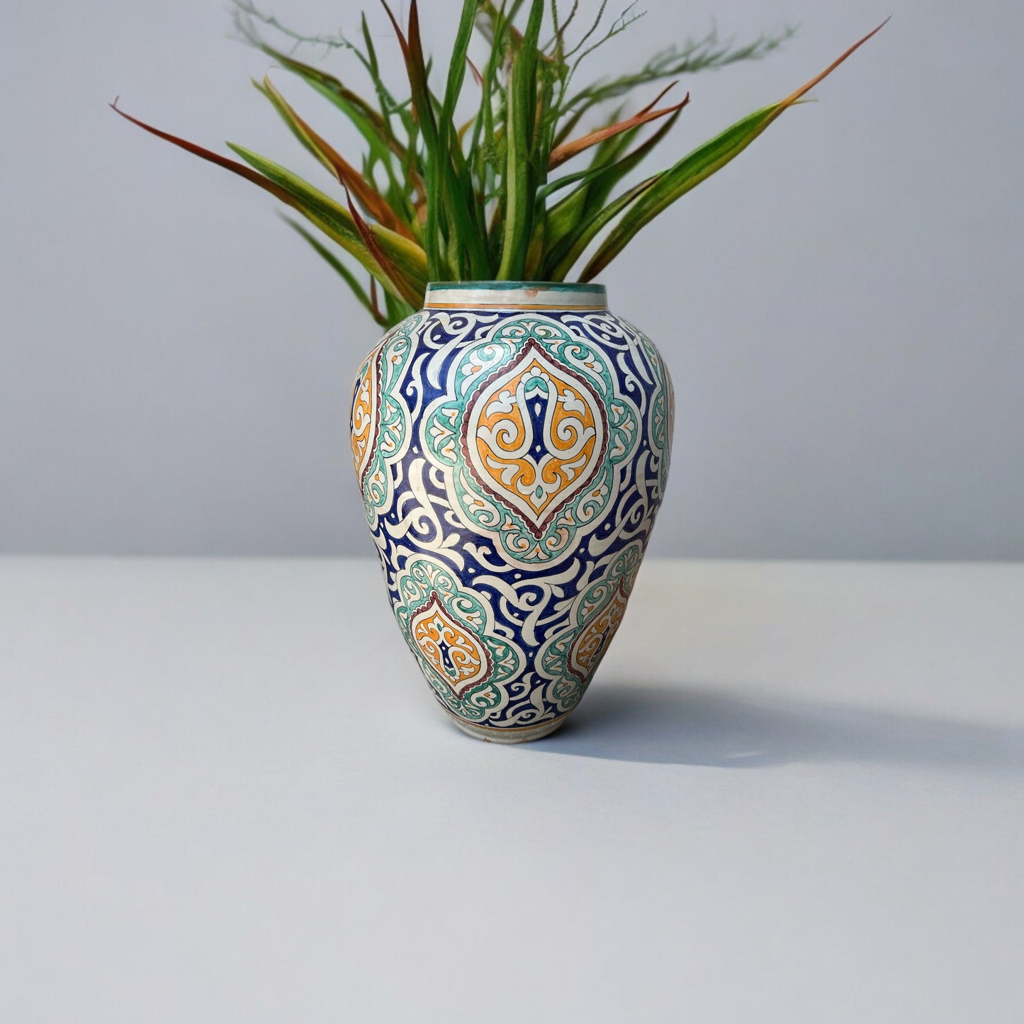 Large antique Fez urn made of pottery with intricate designs by Justmorocco, showcasing traditional Moroccan craftsmanship.
