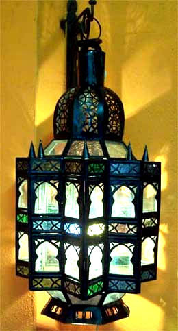 Colorful Moroccan Kutubia lantern by Justmorocco with intricate metalwork and vibrant glass panels for decorative lighting.