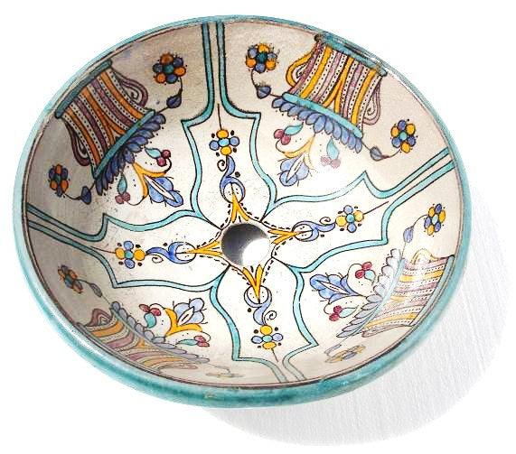 Antique Fes vessel sink with Moroccan tile design by Justmorocco, featuring a round ceramic basin with intricate blue and white patterns.