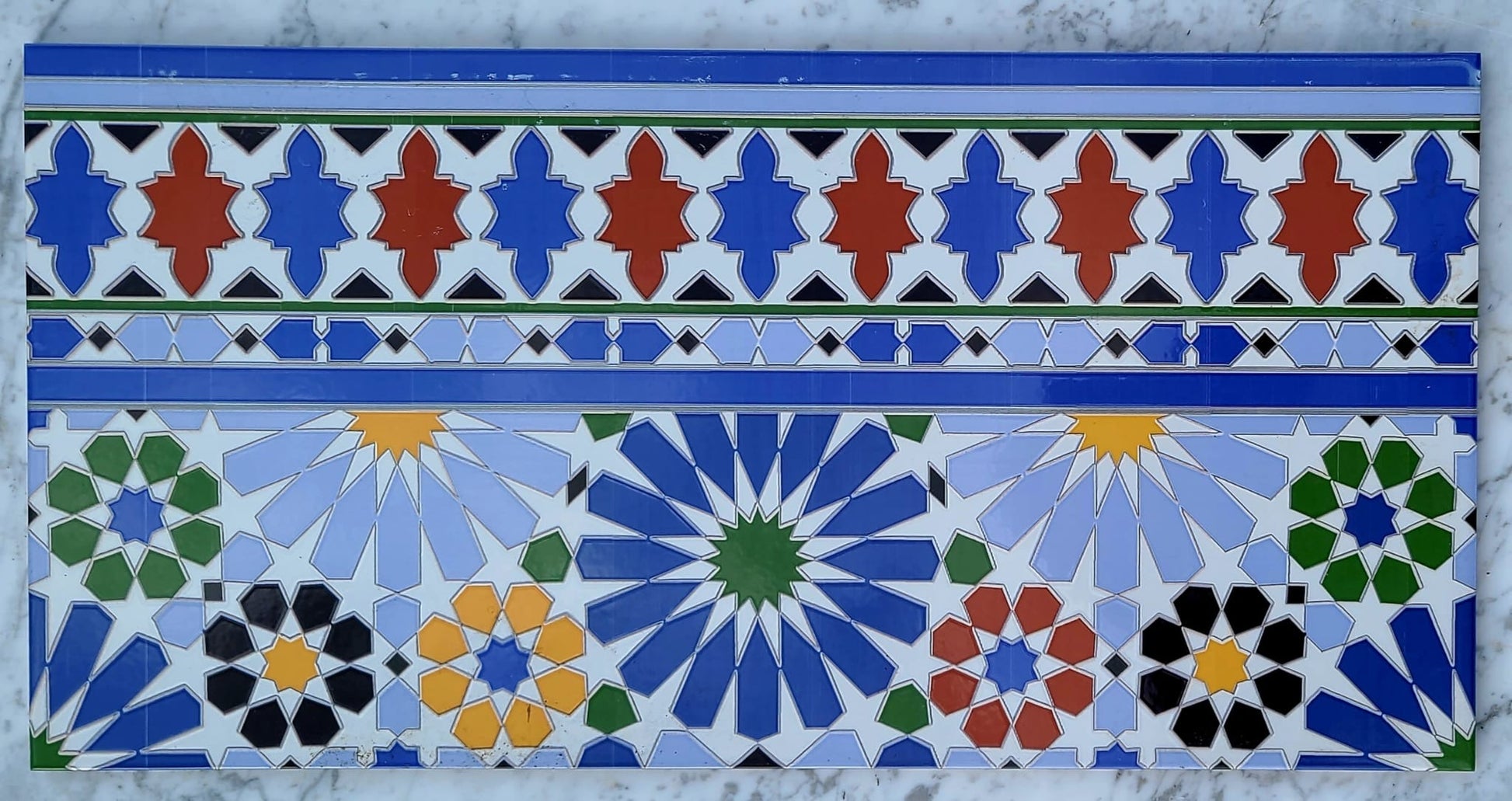 Colorful Moroccan Andalusia tile pack by Justmorocco, showcasing intricate patterns and vibrant ceramic tiles for decorative use.