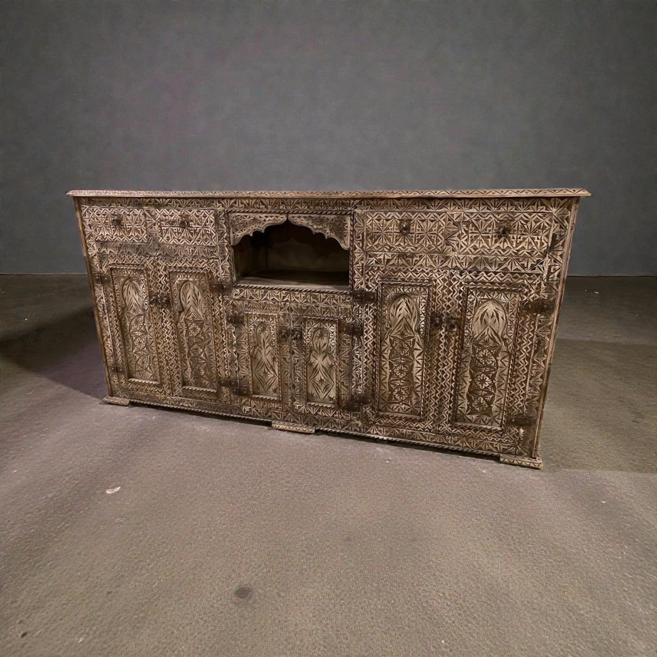 Moroccan carved cabinet by Justmorocco featuring intricate traditional wood carvings and ornate detailing.