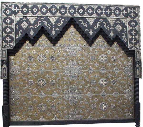Moroccan Harem bed with vibrant, patterned bedding from Justmorocco, featuring traditional Moroccan textiles and decorative cushions.