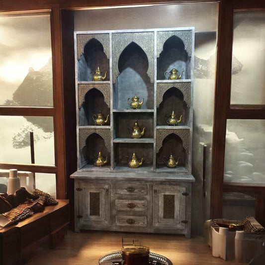 Moroccan arch shelf cabinet with three drawers and two door panels 