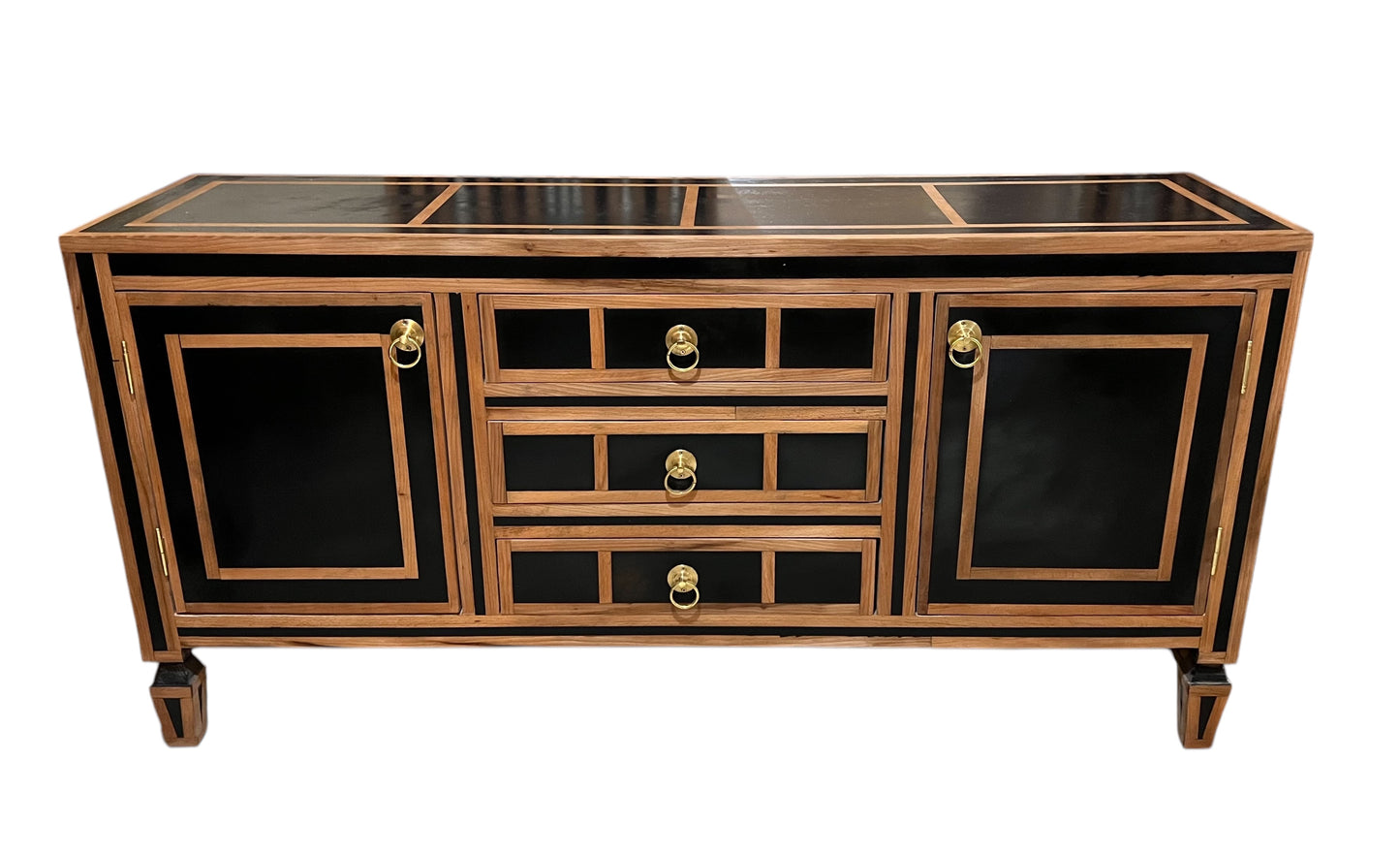 A Moroccan style cabinet with dark wood door panels and resin details, featuring multiple drawers.