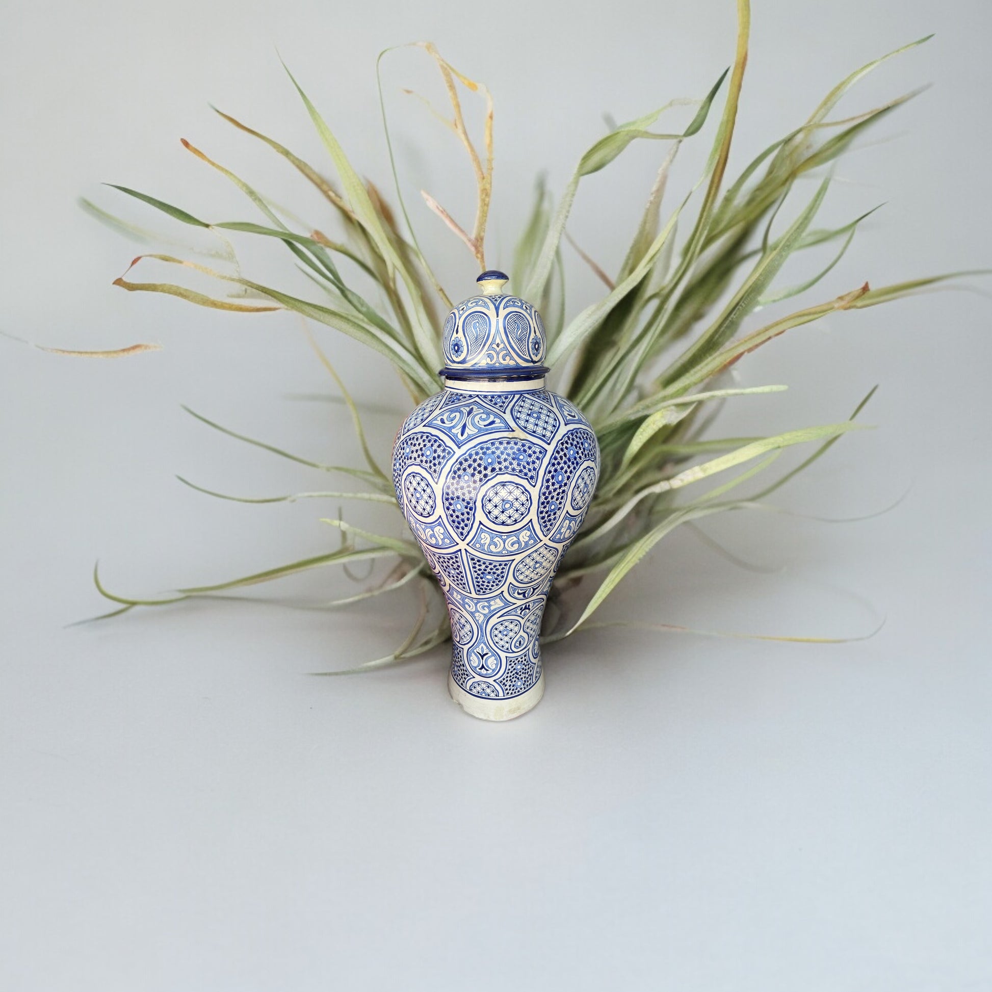 Blue Fez antique pottery from Justmorocco, showcasing traditional Moroccan ceramic design with intricate patterns and a glossy finish.