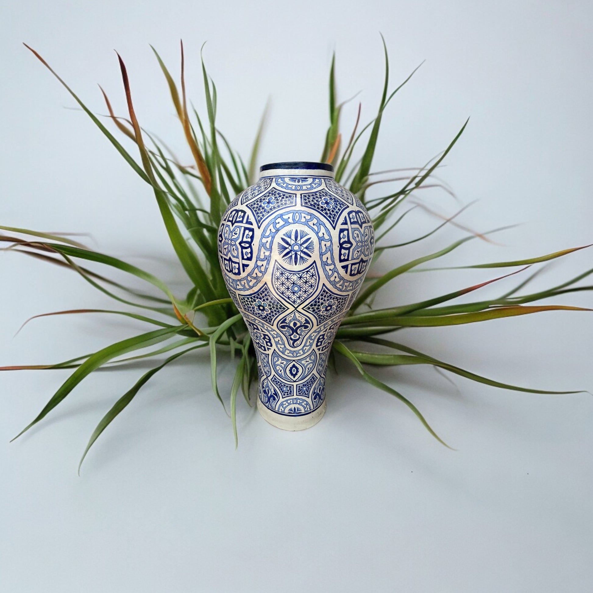 Antique pottery traditional Fez urn with intricate designs, crafted by Justmorocco, showcasing Moroccan ceramic artistry.