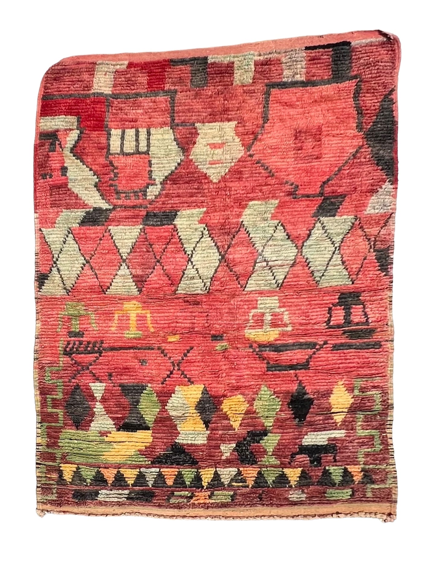 A multicolored, geometric-patterned wool rug, predominantly in blue and red, with abstract tufted designs.