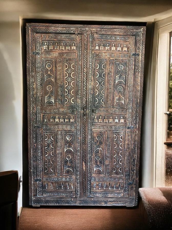 Handmade Moroccan Touareg African armoire by Justmorocco, tribal wooden cabinet with intricate ethnic carvings for bedroom decor