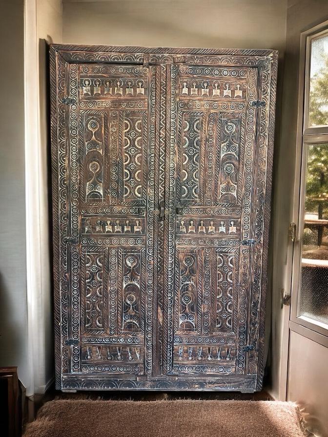 Handmade Moroccan Touareg wooden armoire with tribal patterns, Moroccan ethnic furniture, ideal for bedroom storage.