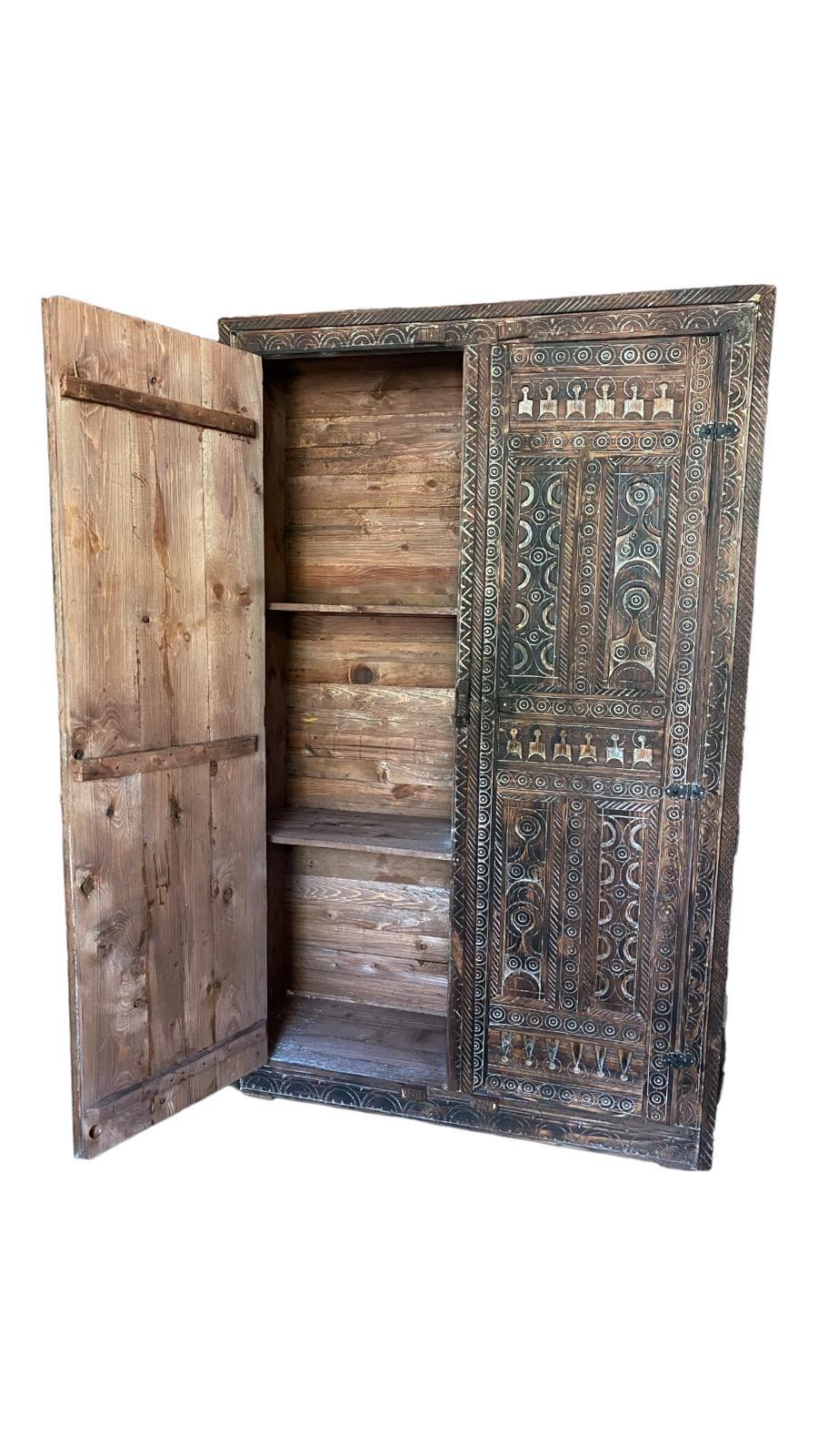 Handmade Touareg African armoire by Justmorocco, featuring Moroccan tribal wooden cabinet with intricate ethnic patterns for bedroom decor.