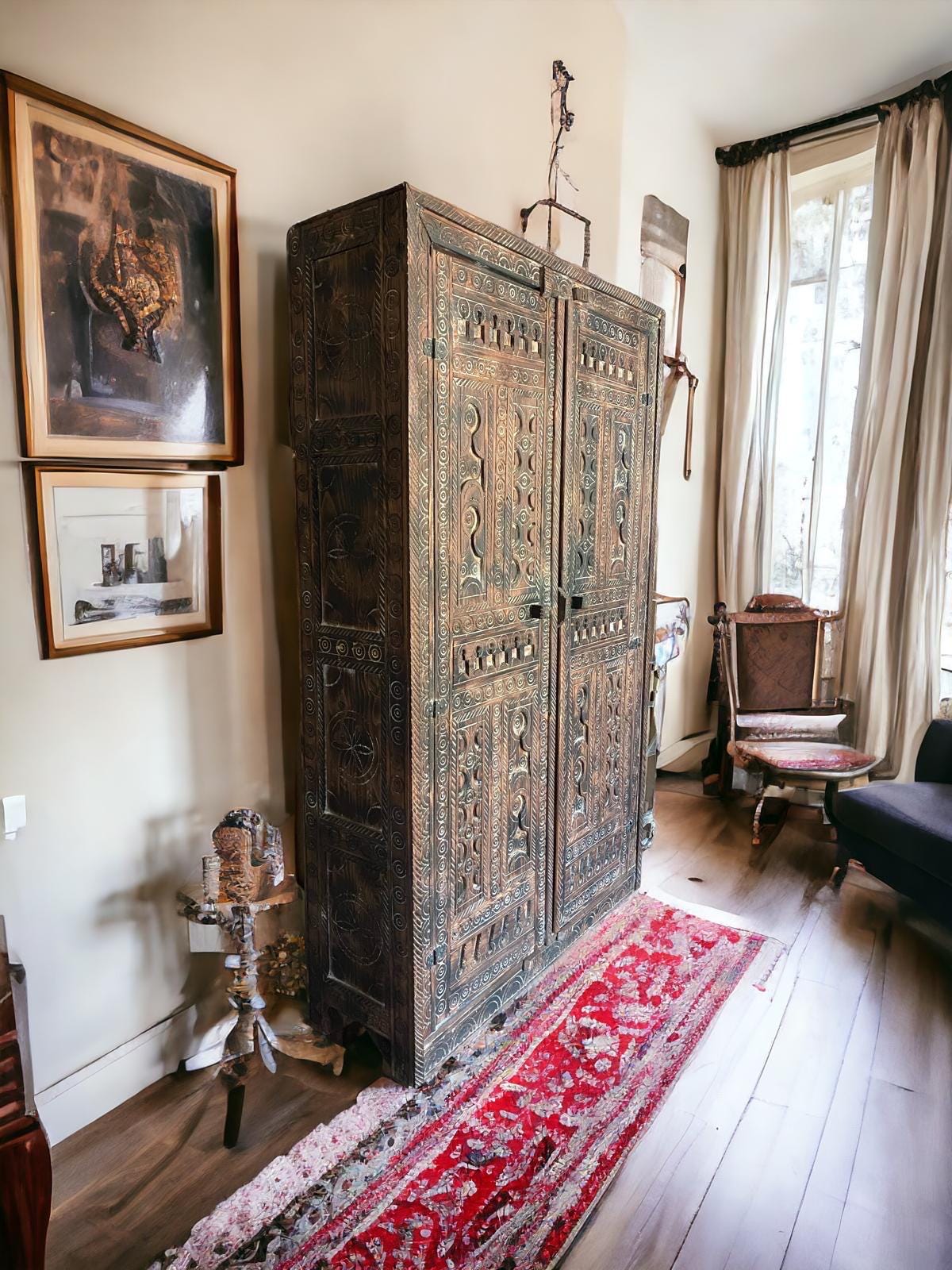 Handmade wooden Touareg African armoire with Moroccan tribal design, featuring intricate patterns and unique ethnic craftsmanship.