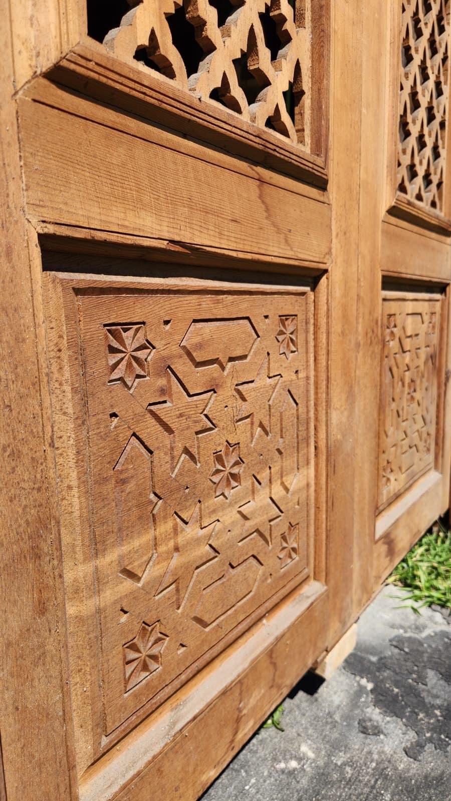 Old Moorish cedar wood door with fleur de lys panel carving, measuring 88 by 47 inches, crafted by Justmorocco.