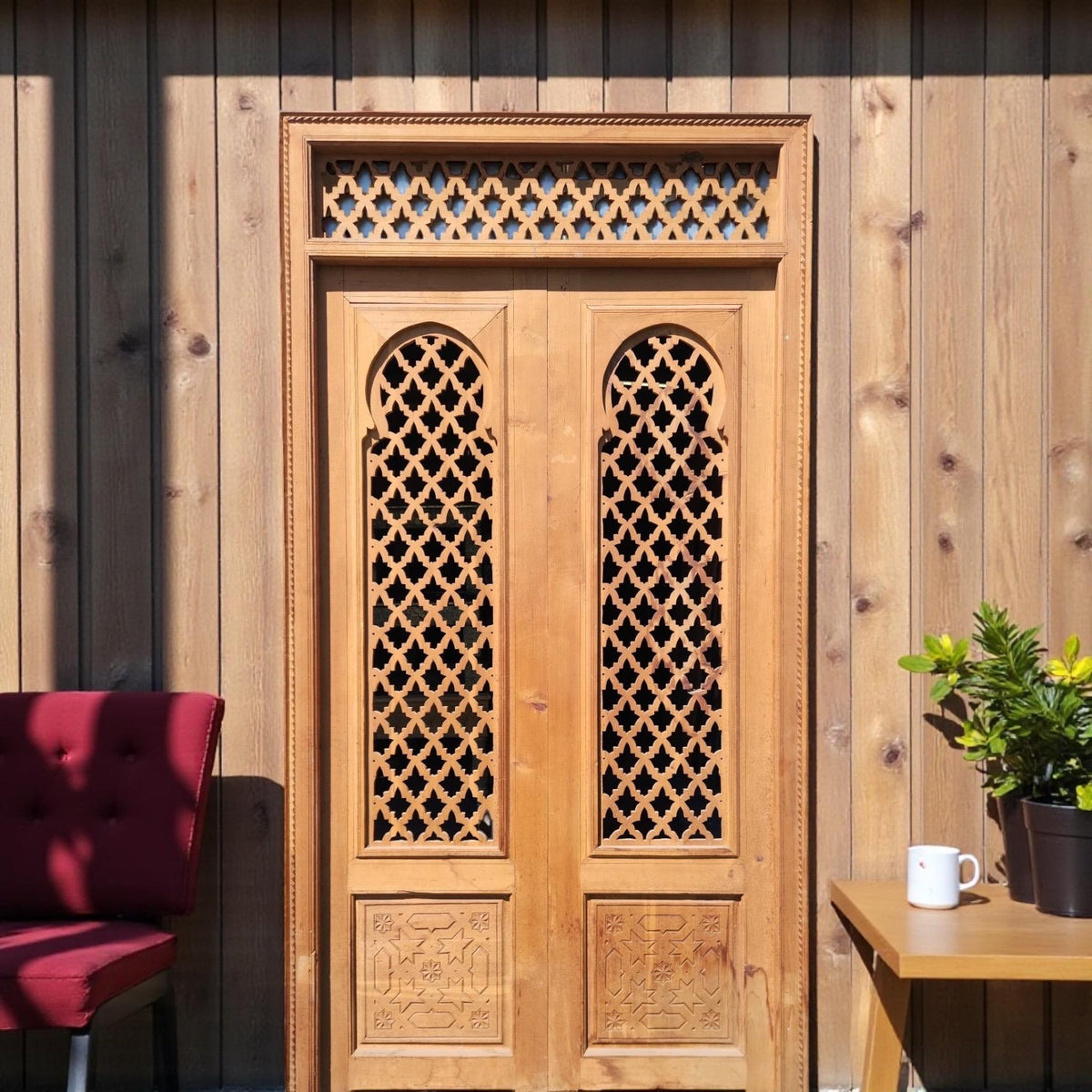 Old Moorish cedar wood door with fleur de lys panel carving, measuring 88 x 47 inches, by Justmorocco.