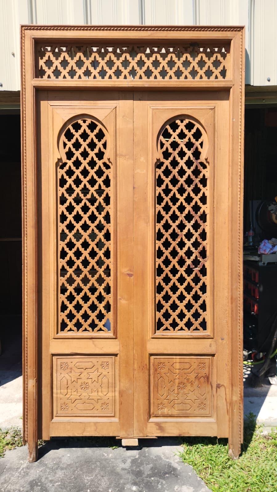 Old Moorish cedar wood door with fleur de lys panel carving, measuring 88x47 inches, by Justmorocco.