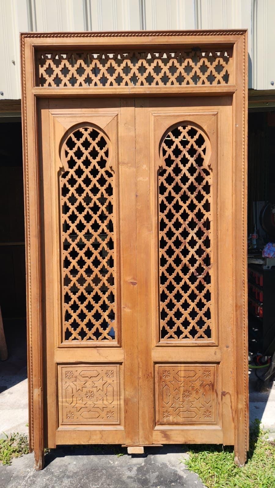 Old Moorish cedar wood door with Fleur de Lys panel carving, measuring 88x47 inches, by Justmorocco.